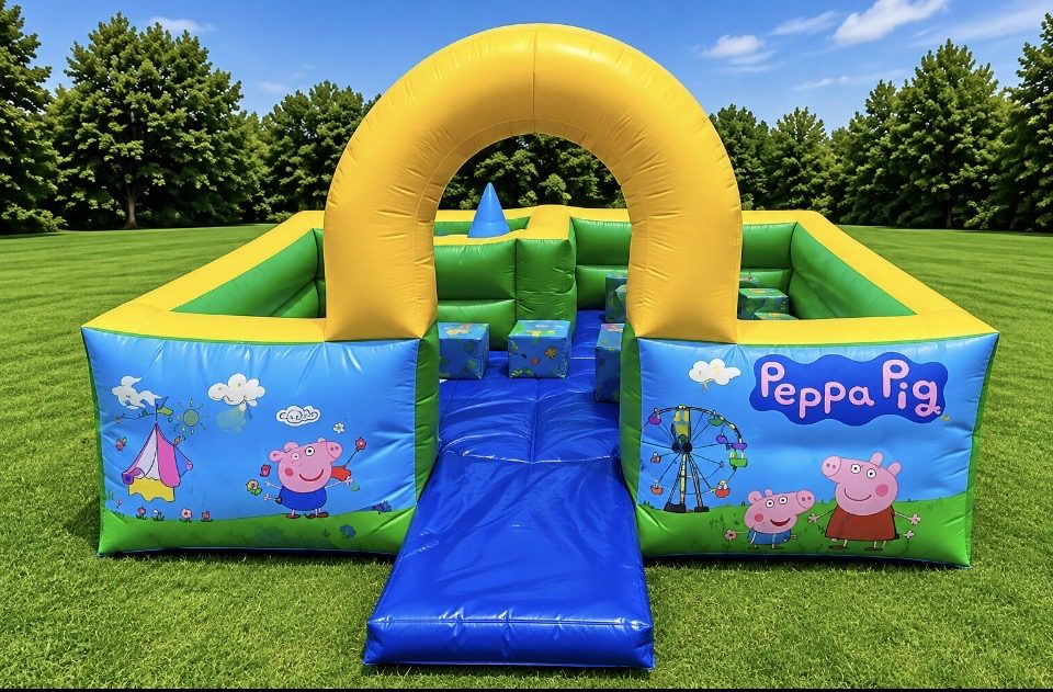 Peppa Pig themed soft play pen with yellow arch and soft blocks on a lawn